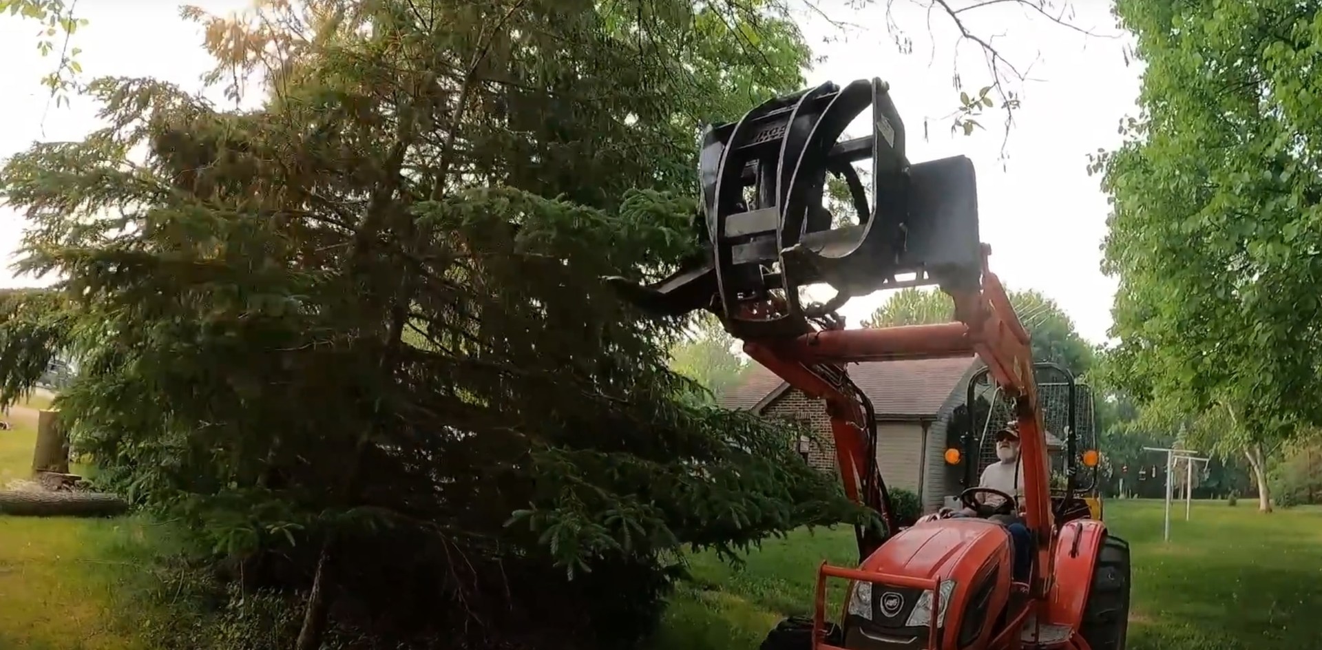 Heavy equipment for safe tree removal in Lombard Professional tree removal equipment including grapple and heavy machinery